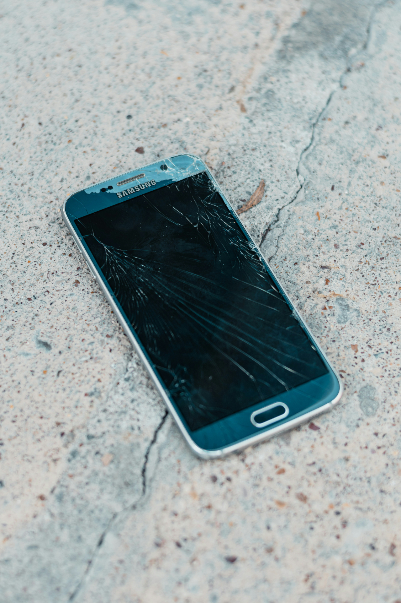 Cracked device screen brought in for repair at The Broken Gadget